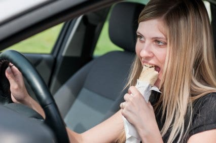 Woman Eating in Car
